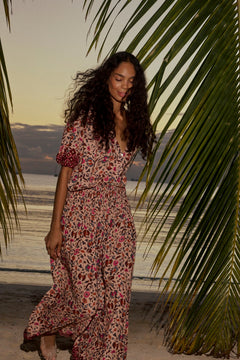Natalie Martin Bella Skirt Wildflower Spice lifestyle image with floral maxi skirt and soft drape at the beach