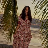 Natalie Martin Bella Skirt Wildflower Spice tropical sunset campaign image with flowing floral skirt and gathered waist