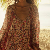 Natalie Martin Fiore Maxi Wildflower Spice floral dress close-up with deep neckline and lightweight rayon texture