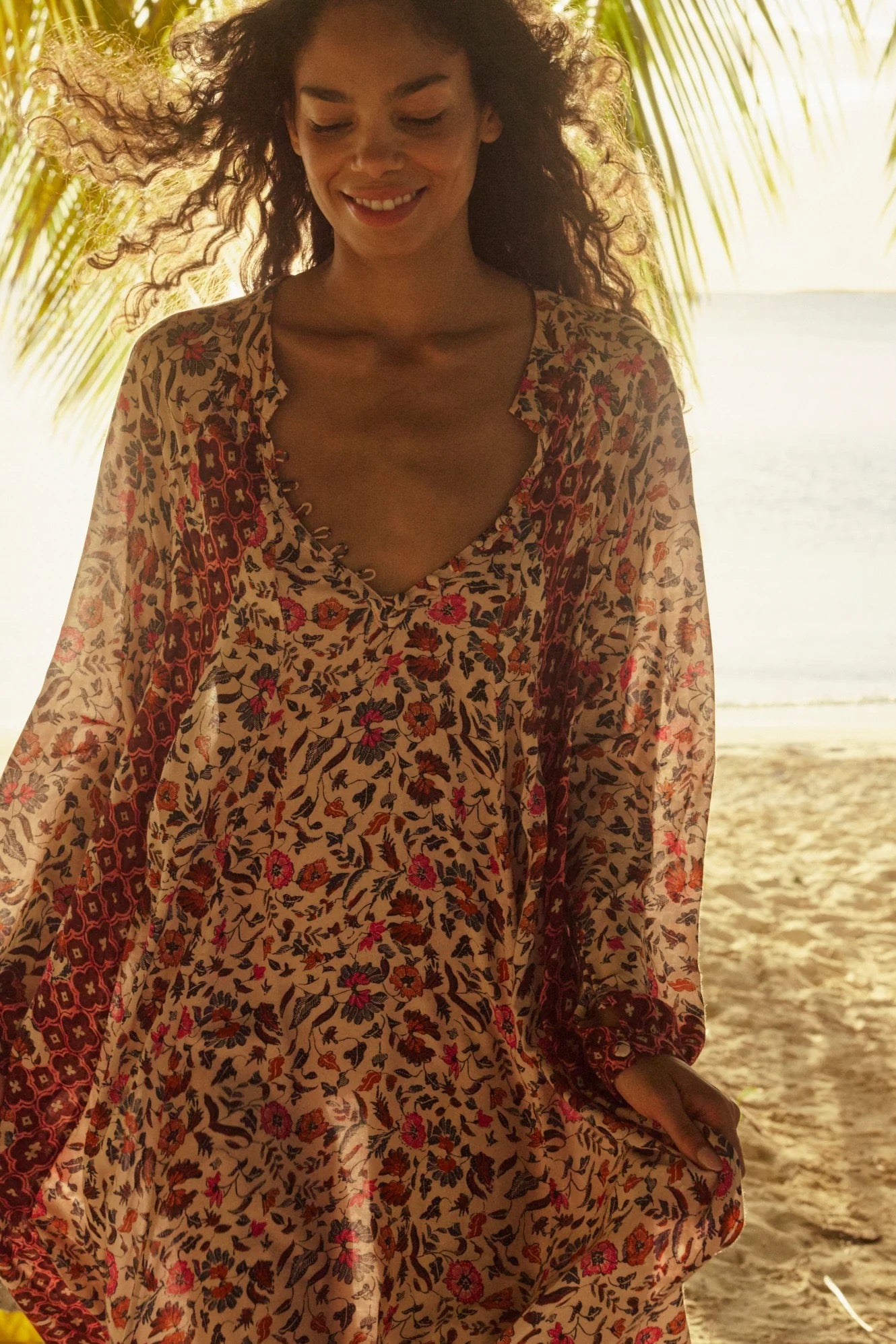 Natalie Martin Fiore Maxi Wildflower Spice floral dress close-up with deep neckline and lightweight rayon texture