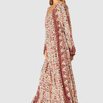 Natalie Martin Fiore Maxi Wildflower Spice floral maxi dress side profile with long sleeves and border print