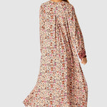 Natalie Martin Fiore Maxi Wildflower Spice floral maxi dress back view with flowing silhouette and long sleeves