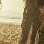 Natalie Martin Monica Dress Delphi Ink beachside editorial image with fluid silhouette