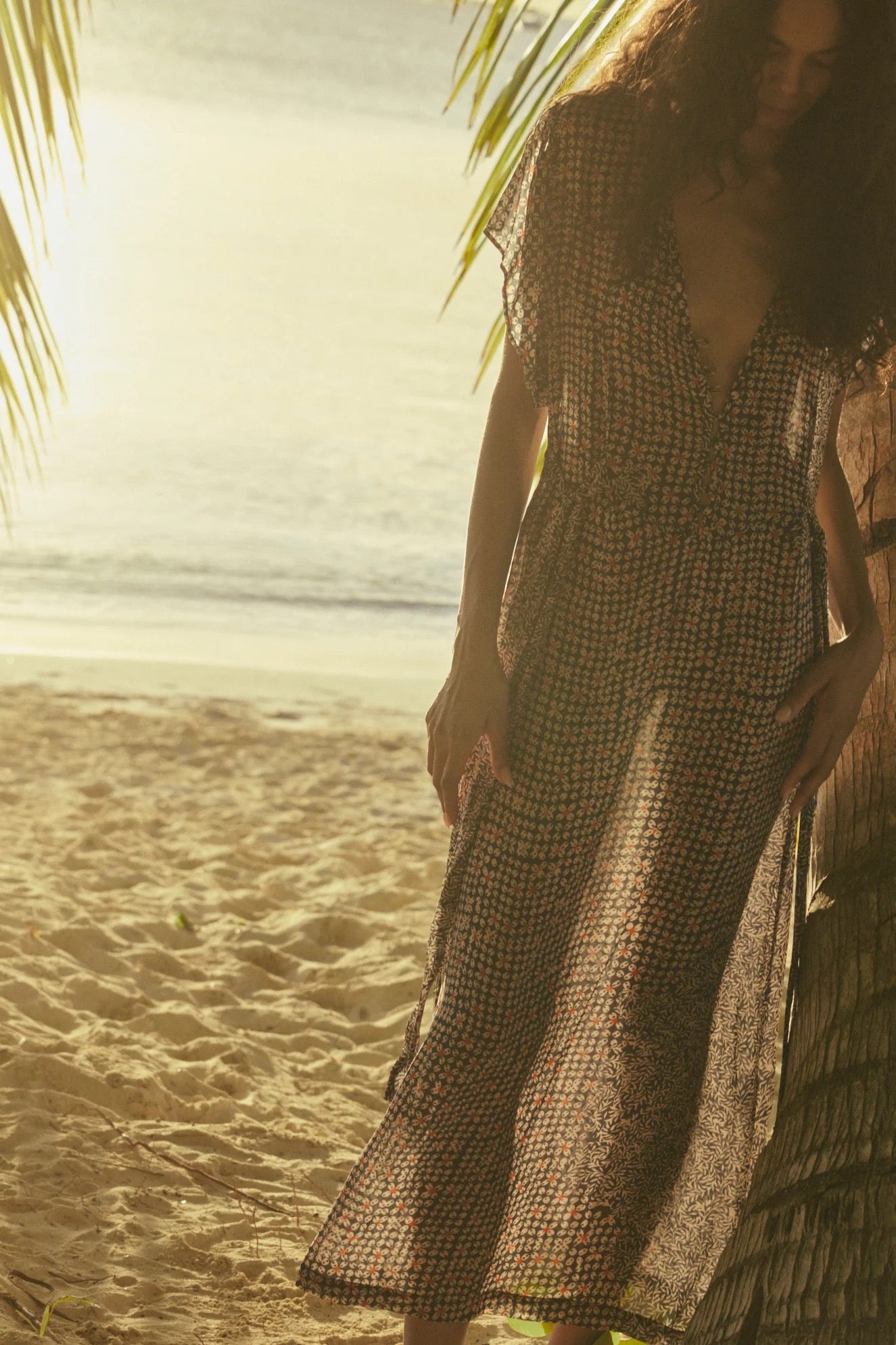 Natalie Martin Monica Dress Delphi Ink beachside editorial image with fluid silhouette