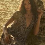 Natalie Martin Monica Dress Delphi Ink deep v-neck printed maxi dress on beach
