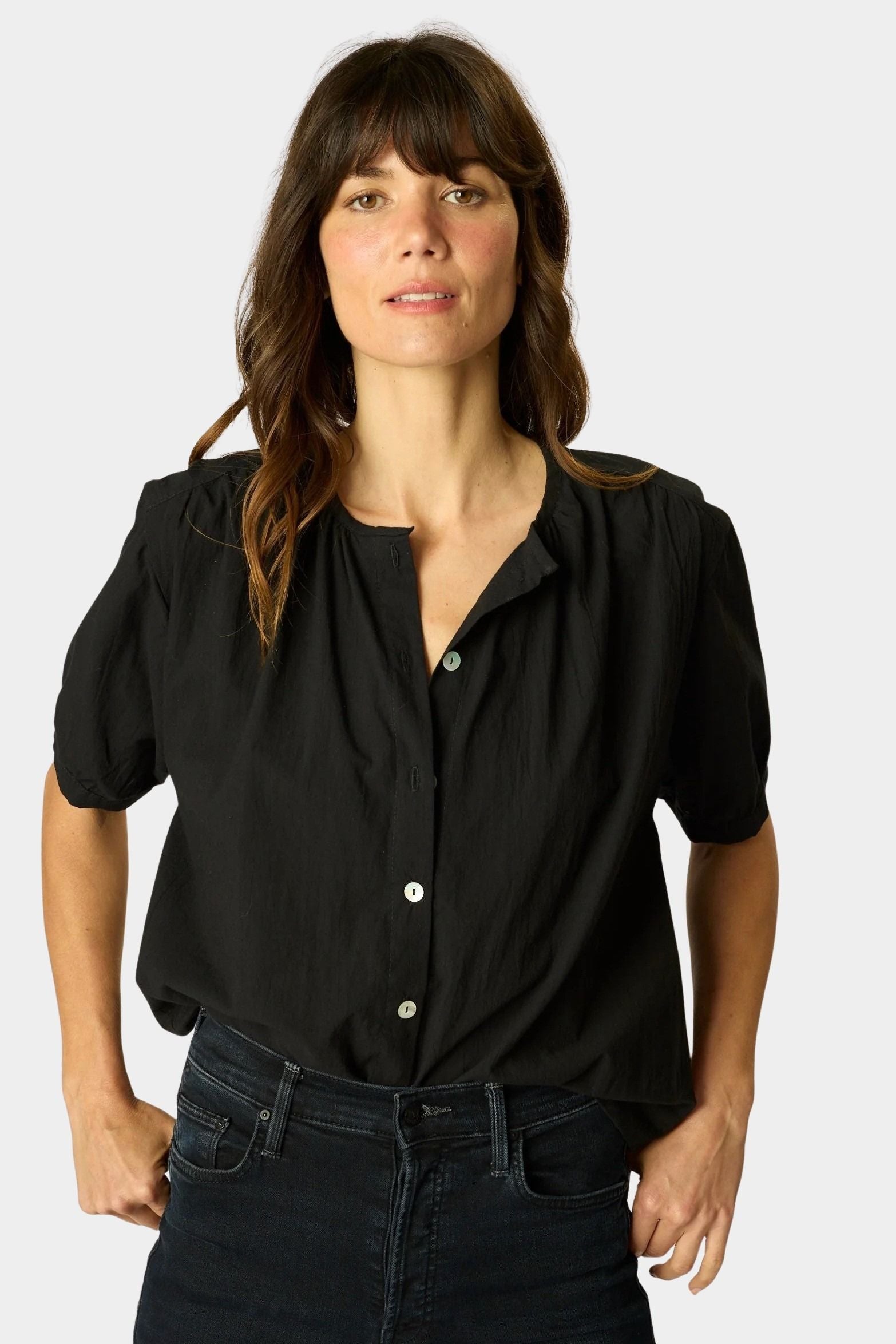 Close-up of Natalie Martin Violet Top in Black Flat Cotton with shell button detailing