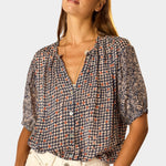 Natalie Martin Violet Top Delphi Ink close-up portrait with mixed floral print and soft gathered neckline