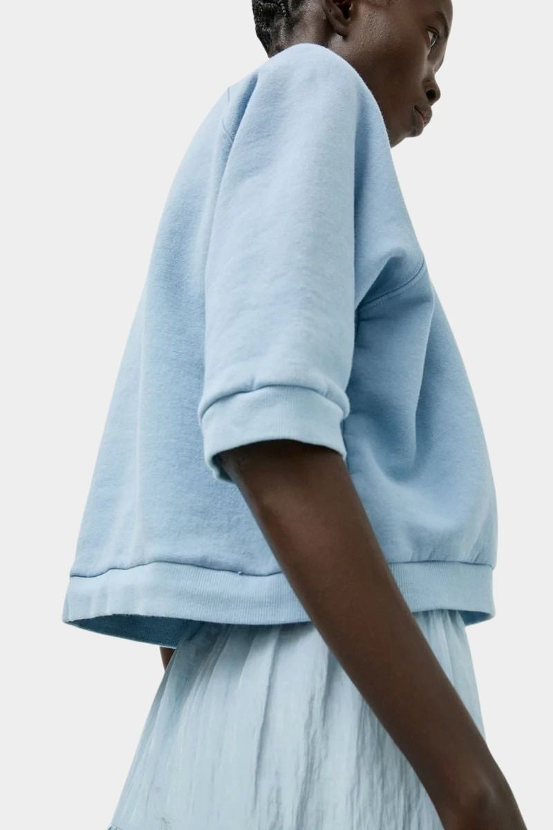Side view of No.6 Emily Sweatshirt Chambray with relaxed cotton silhouette and rib trim at SHOP YUCCA Denver