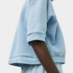 Side view of No.6 Emily Sweatshirt Chambray with relaxed cotton silhouette and rib trim at SHOP YUCCA Denver
