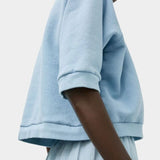 Side view of No.6 Emily Sweatshirt Chambray with relaxed cotton silhouette and rib trim at SHOP YUCCA Denver