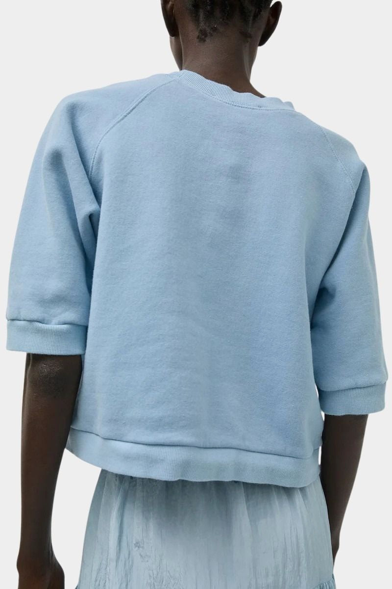 No.6 Emily Sweatshirt Chambray viewed from back with cropped boxy fit and elbow-length sleeves at SHOP YUCCA Denver