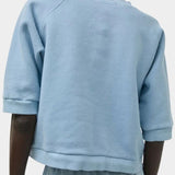 No.6 Emily Sweatshirt Chambray viewed from back with cropped boxy fit and elbow-length sleeves at SHOP YUCCA Denver