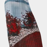 Side view of No.6 Hiroko skirt in Cinema print featuring vertical pleating, blurred landscape imagery, and lightweight midi length