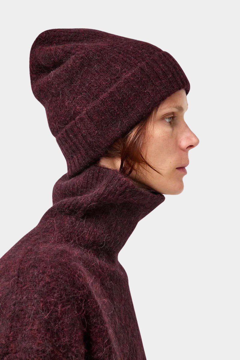No.6 Knit Beanie in Bordeaux worn with a matching sweater, side view of the folded cuff at YUCCA Denver