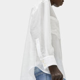No.6 Lake Shirt in White Organza shown from the side with semi sheer oversized silhouette, curved hem, elongated cuffs, and lightweight airy drape.