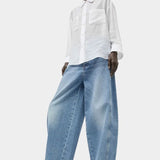 No.6 Lake Shirt in White Organza styled with wide leg light wash denim, featuring a relaxed fit, semi sheer texture, and oversized button-down silhouette.