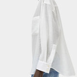 Side profile of the No.6 Lake Shirt in White Organza featuring sheer lightweight fabric, oversized drape, patch pocket detail, and extended cuffs.