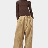 No.6 Lennon Turtleneck in Espresso, full length styling with wide leg tan pants