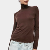 No.6 Lennon Turtleneck in Espresso, front view with lettuce hem and light denim at YUCCA Denver