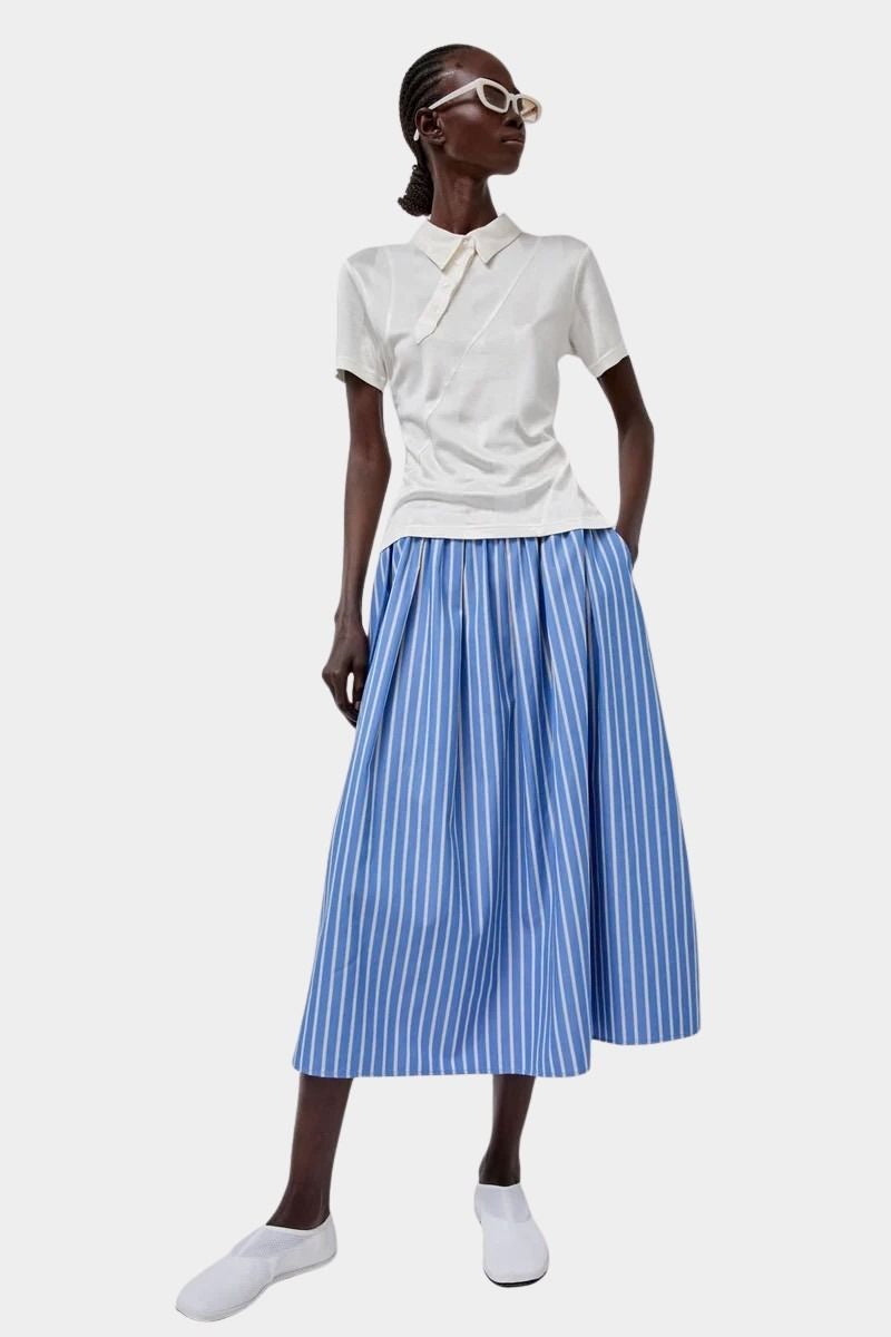 No.6 Mel Skirt in Eton Stripe blue and white striped cotton midi skirt styled with cream polo and white sunglasses full look