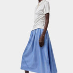 No.6 Mel Skirt in Eton Stripe blue and white cotton A-line midi skirt styled with cream short sleeve polo and white slip on shoes