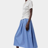 No.6 Mel Skirt in Eton Stripe blue and white cotton A-line midi skirt styled with cream short sleeve polo and white slip on shoes