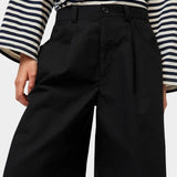 No.6 Mick Short in black cotton ripstop bermuda shorts front view showing button closure and pleated front