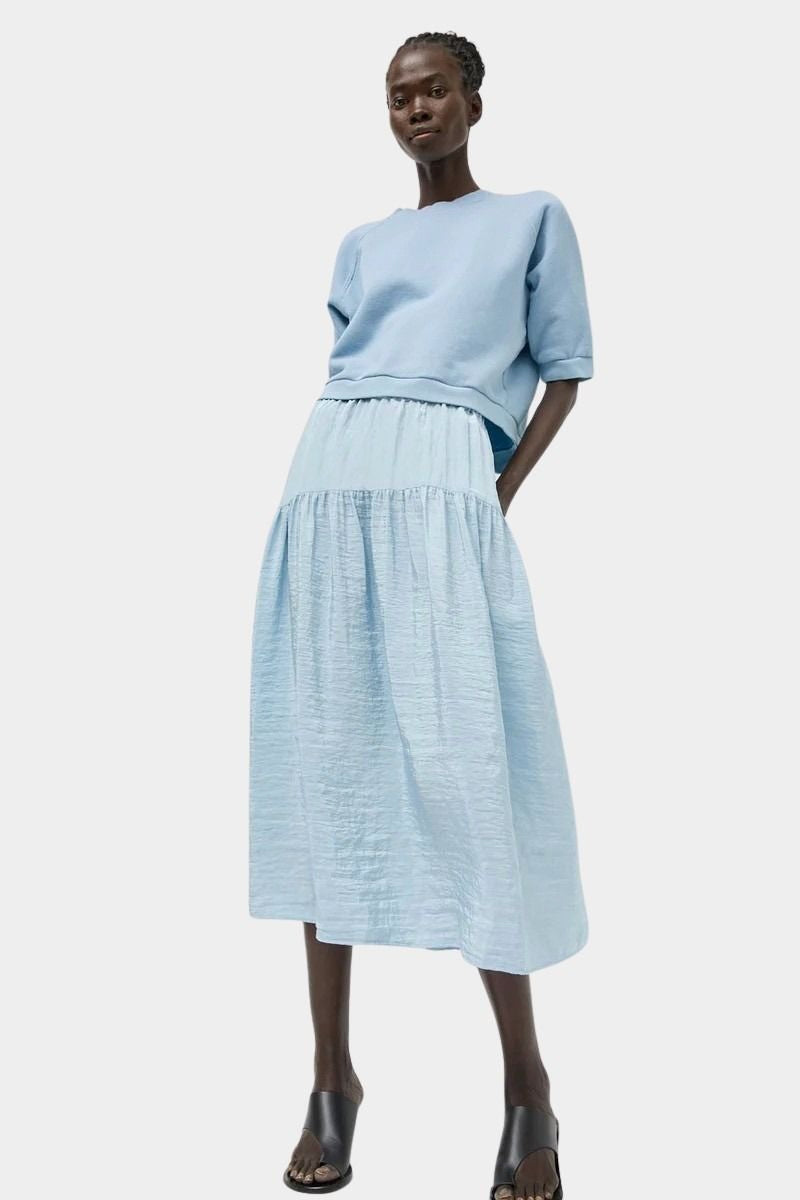 Full look featuring No.6 Sophia Skirt Sky paired with cropped cotton sweatshirt at SHOP YUCCA Denver