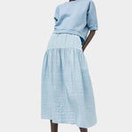 Full look featuring No.6 Sophia Skirt Sky paired with cropped cotton sweatshirt at SHOP YUCCA Denver