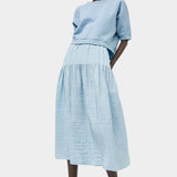 Full look featuring No.6 Sophia Skirt Sky paired with cropped cotton sweatshirt at SHOP YUCCA Denver
