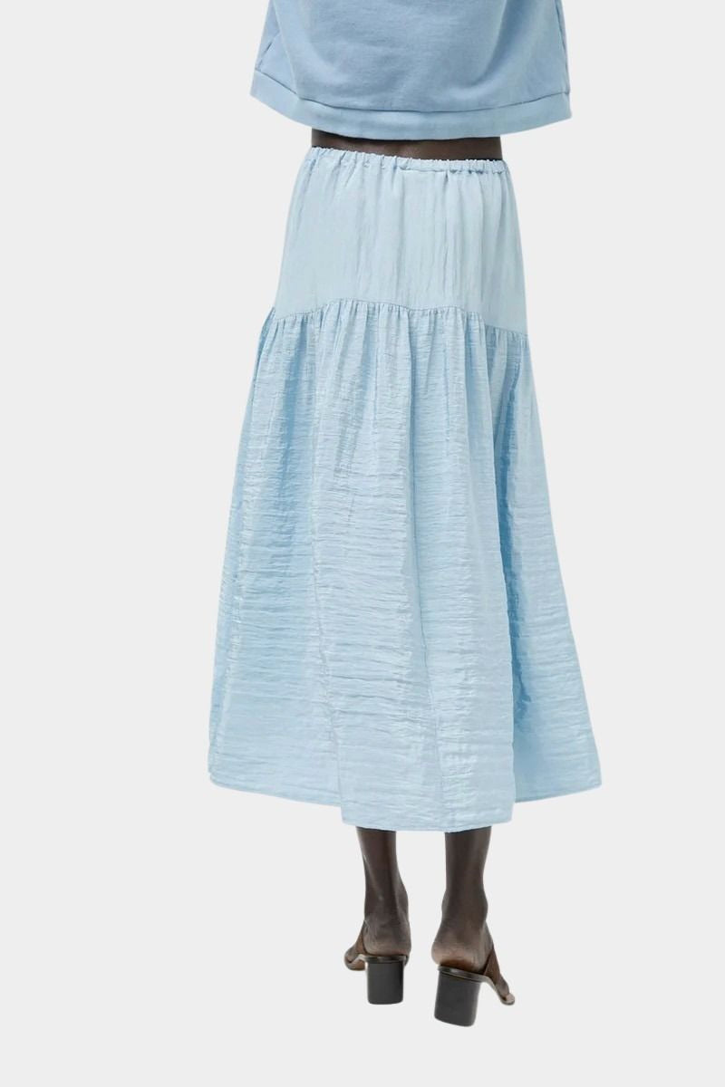 Back view of No.6 Sophia Skirt Sky featuring elastic waistband and full gathered skirt at SHOP YUCCA Denver
