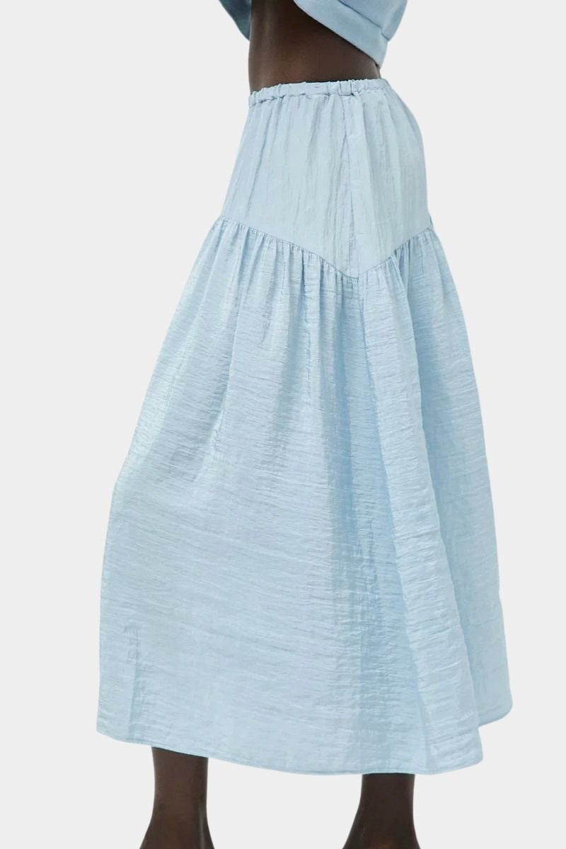 Side view of No.6 Sophia Skirt Sky with fluid drape and lightweight textured fabric at SHOP YUCCA Denver