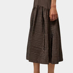 Relaxed textured skirt in deep slate tone with elastic waistband and full silhouette at SHOP YUCCA Denver