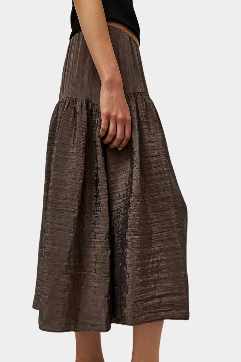 Side profile of slate grey midi skirt with fluid drape and subtle shine by No.6 at SHOP YUCCA Denver