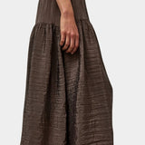 Side profile of slate grey midi skirt with fluid drape and subtle shine by No.6 at SHOP YUCCA Denver