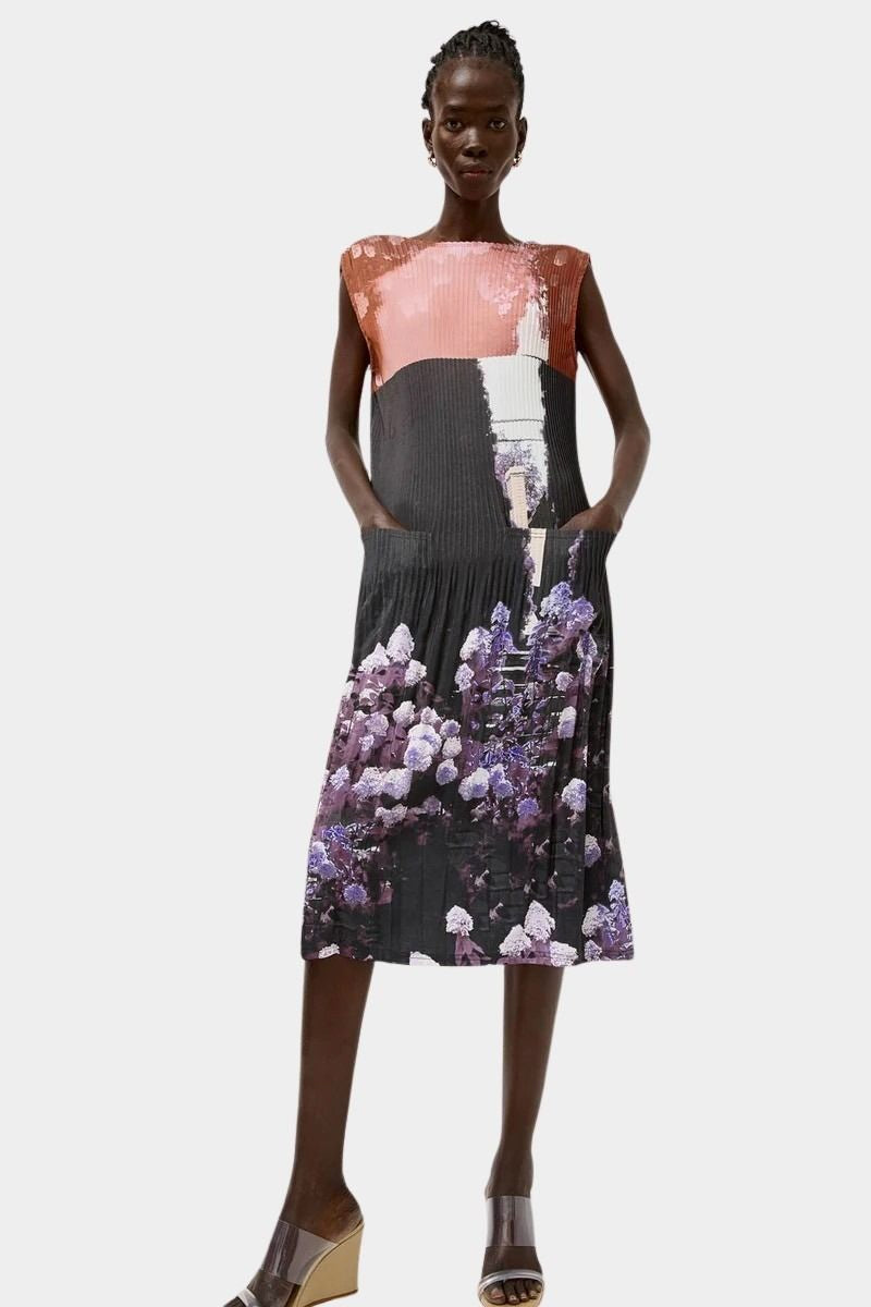 Front view of the No.6 Tierney Dress in Eclipse with pleated sleeveless construction, relaxed midi silhouette, side pockets, and shadowed floral print.