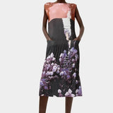 Front view of the No.6 Tierney Dress in Eclipse with pleated sleeveless construction, relaxed midi silhouette, side pockets, and shadowed floral print.