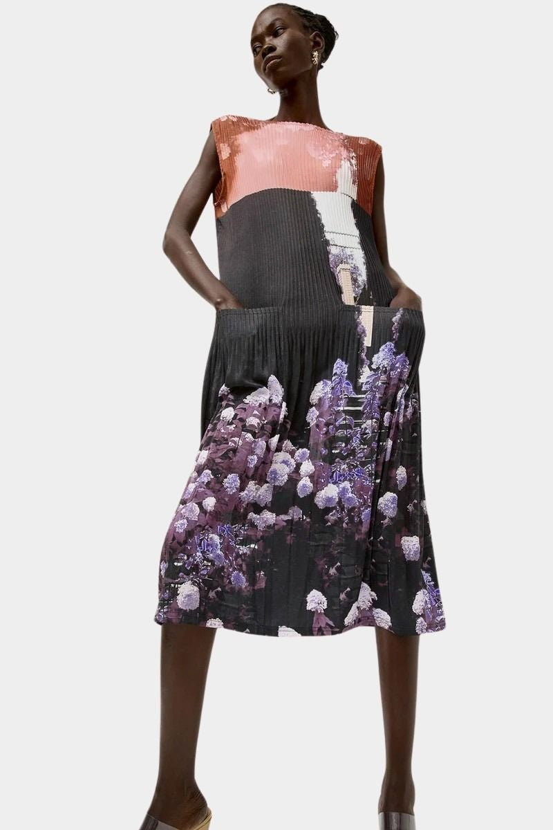 No.6 Tierney Dress in Eclipse styled with side pockets, pleated texture, abstract floral print, and lightweight fluid movement through the skirt.