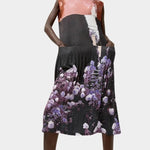 No.6 Tierney Dress in Eclipse styled with side pockets, pleated texture, abstract floral print, and lightweight fluid movement through the skirt.