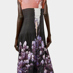 Back view of the No.6 Tierney Dress in Eclipse featuring pleated construction, sleeveless shape, floral photo print, and relaxed midi silhouette.