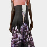 Back view of the No.6 Tierney Dress in Eclipse featuring pleated construction, sleeveless shape, floral photo print, and relaxed midi silhouette.