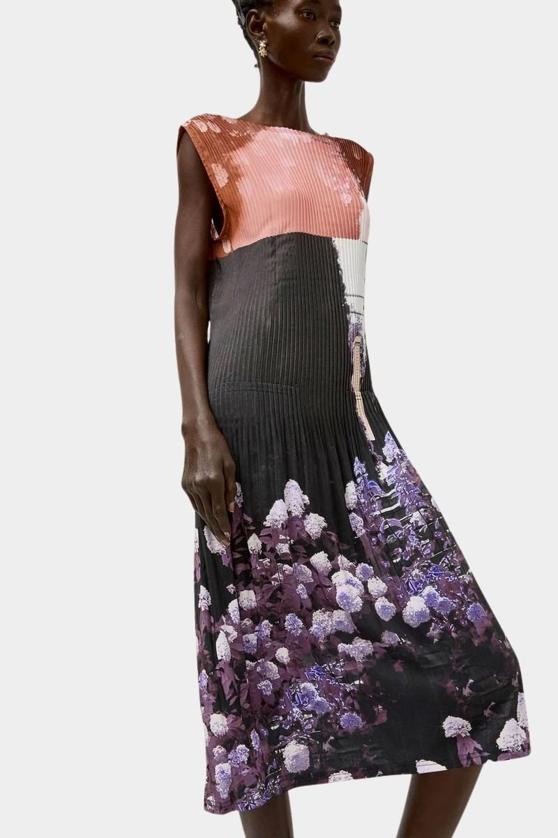 No.6 Tierney Dress in Eclipse with pleated sleeveless silhouette, abstract floral photo print, midi length, and fluid drape in deep black and violet tones.