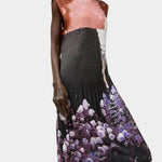 No.6 Tierney Dress in Eclipse with pleated sleeveless silhouette, abstract floral photo print, midi length, and fluid drape in deep black and violet tones.