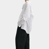 Rachel Comey Ashbolt pant in black, side profile showing sculptural drape and easy silhouette