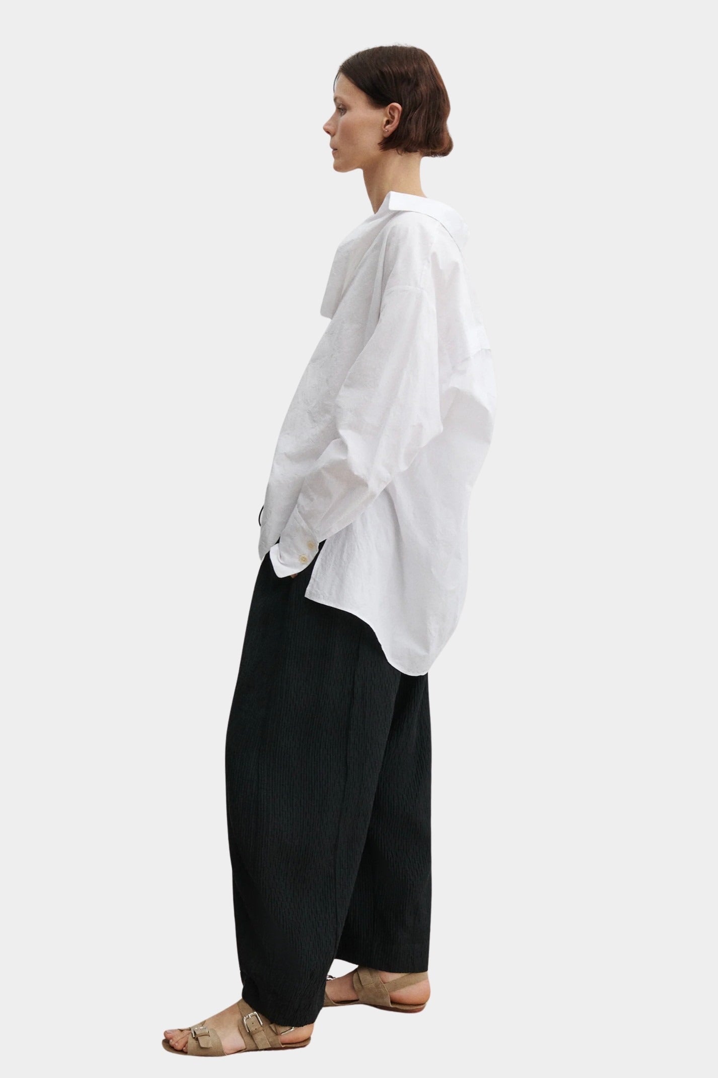 Rachel Comey Ashbolt pant in black, side profile showing sculptural drape and easy silhouette