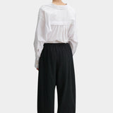 Rachel Comey Ashbolt pant in black, back view highlighting relaxed structure and volume through the leg