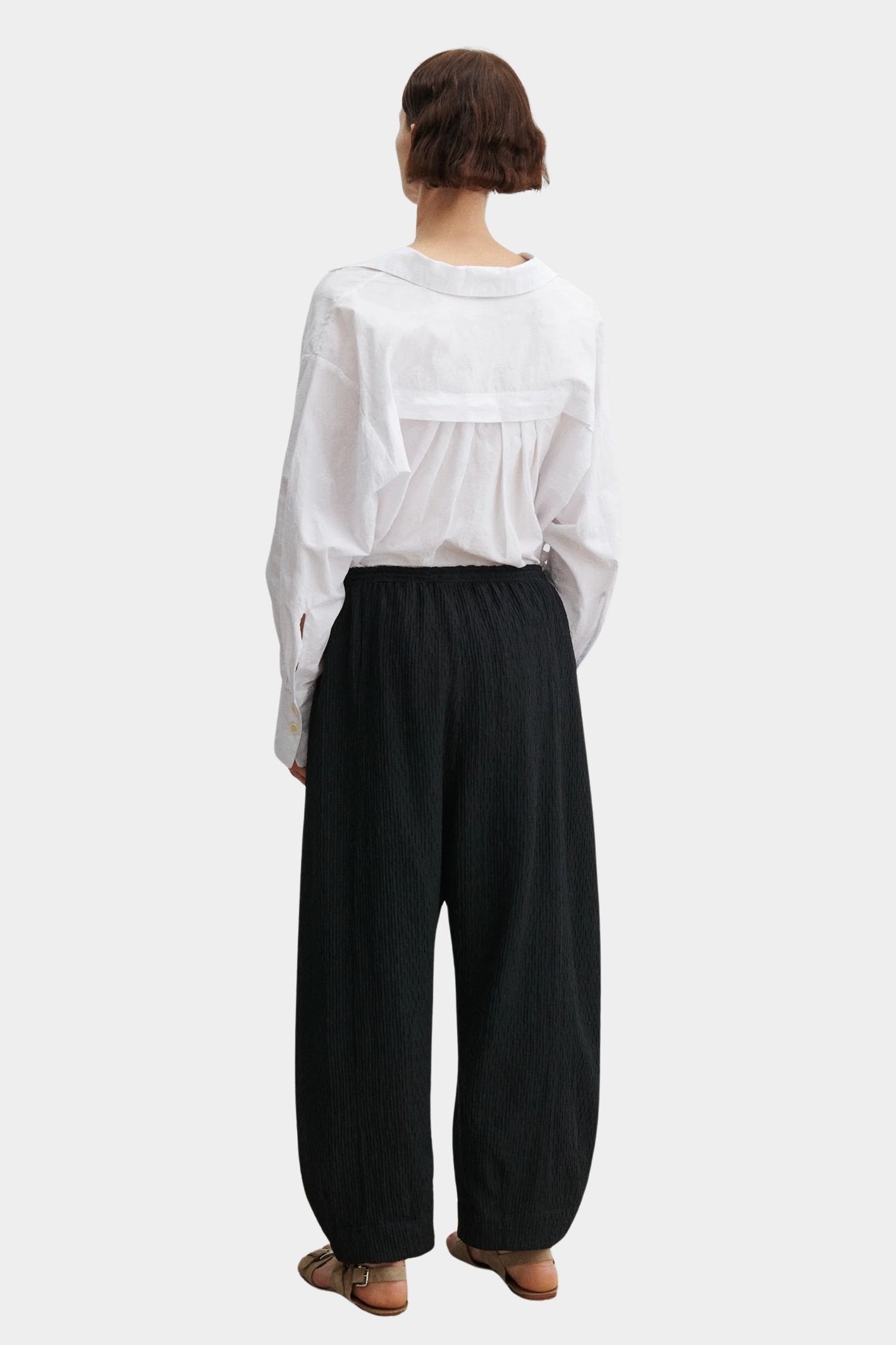 Rachel Comey Ashbolt pant in black, back view highlighting relaxed structure and volume through the leg