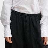 Rachel Comey Ashbolt pant in black, close-up detailing elastic drawstring waistband and textured fabric
