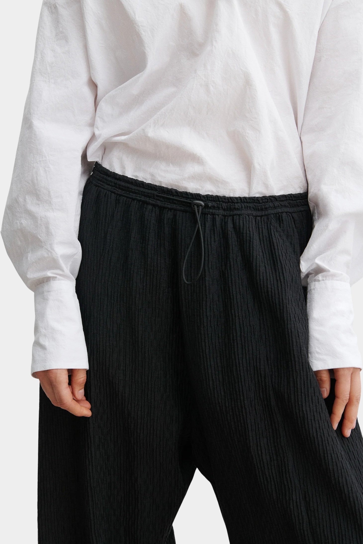Rachel Comey Ashbolt pant in black, close-up detailing elastic drawstring waistband and textured fabric