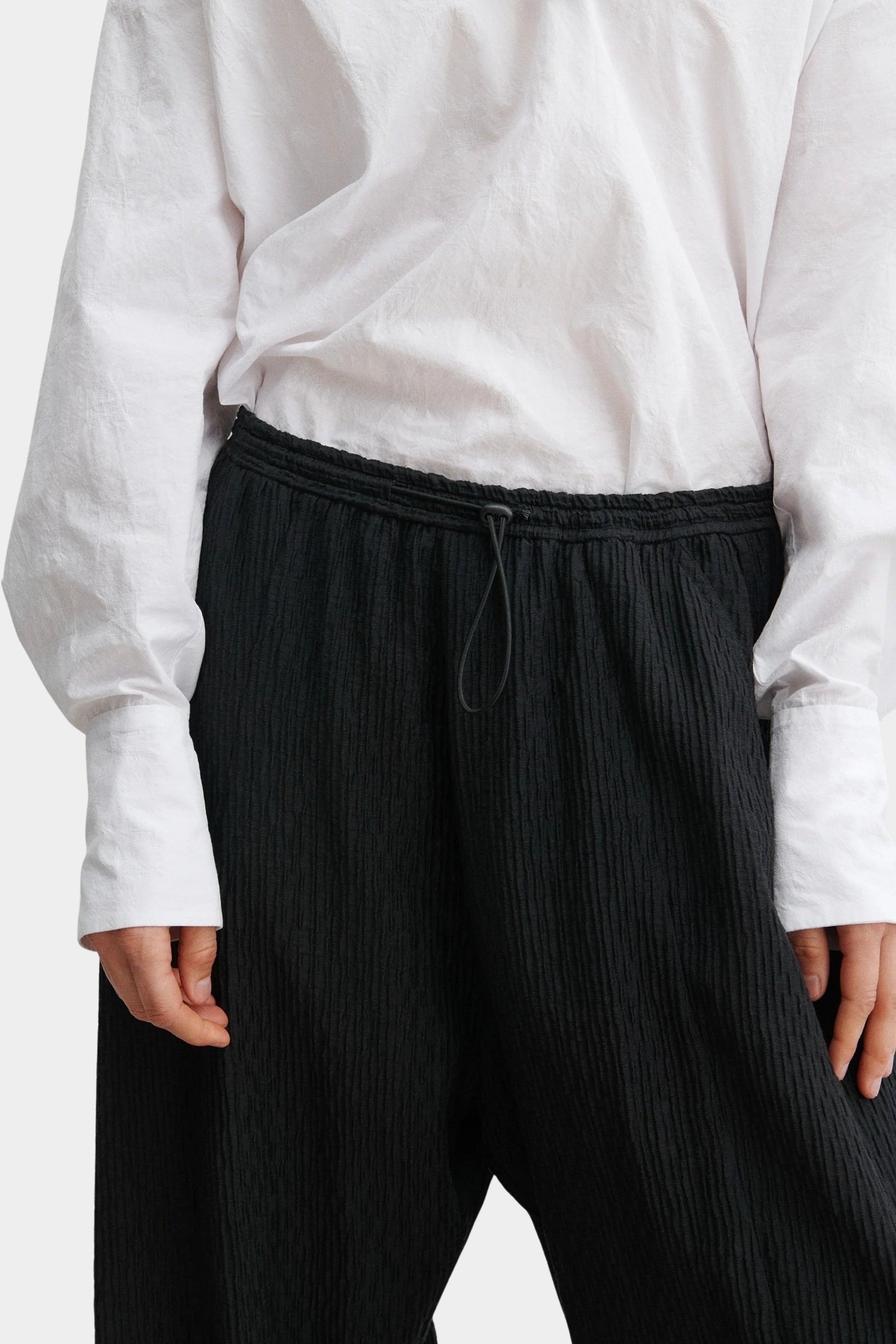 Rachel Comey Ashbolt pant in black, close-up detailing elastic drawstring waistband and textured fabric